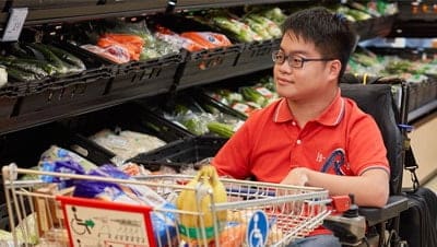 A young man shopping for groceries at the supermarket