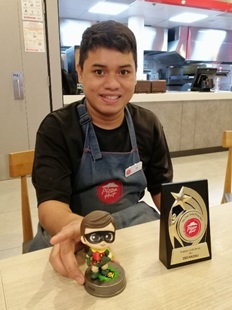 Zed with his Employee of the Month Award, at the Star Vista Pizza Hut outlet